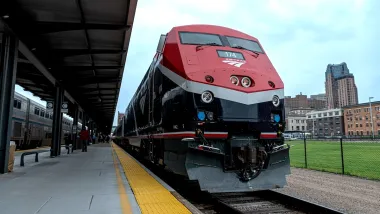 Close-up of red Amtrak Borealis train at station.